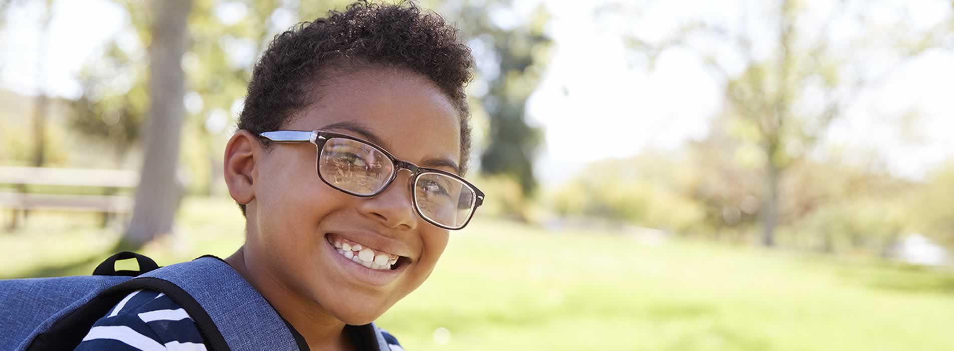 young boy smiling - ready for school