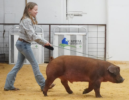 Cherokee Home for Children-girl showing pig